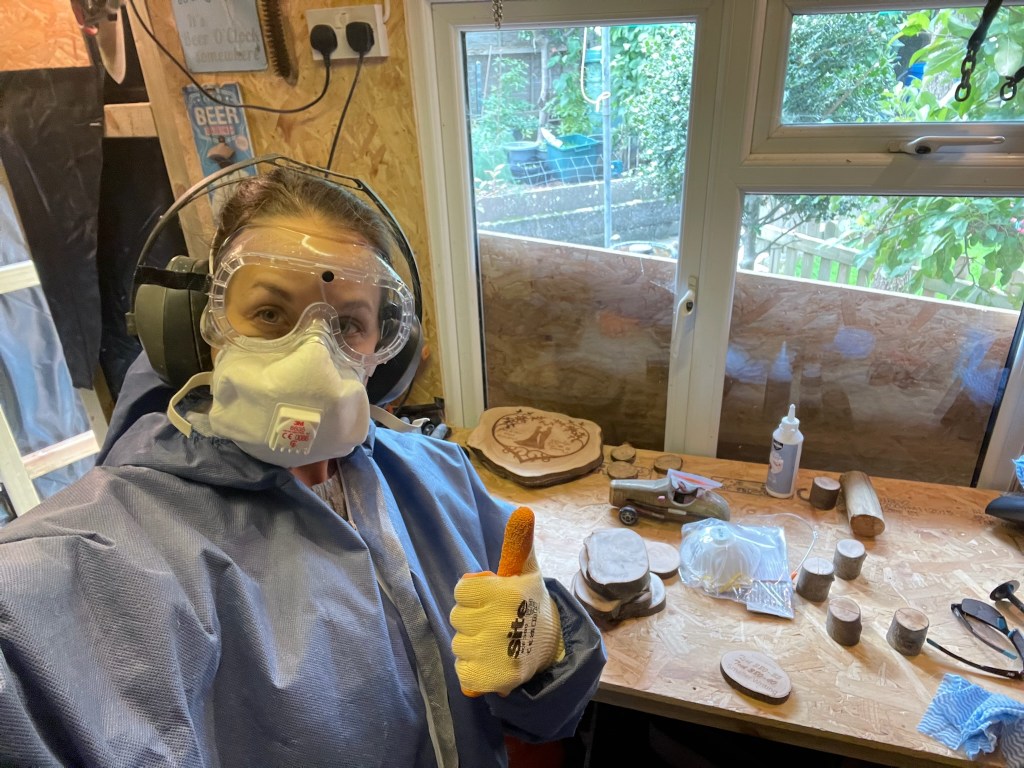 Laser engraving a personalized wooden wedding sign at The Rustic Collection workshop in Bristol, UK